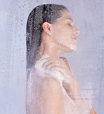 Buy stock photo Shower, washing and hand of woman with puff in studio for hygiene, treatment or morning routine on white background. Body care, glass and model with eyes closed for grooming, water drops or wellness