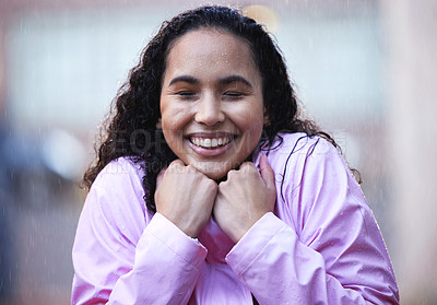 Buy stock photo Young woman, happiness and rain in city with gratitude, downtown and wellness in storm. Female person, water splash and excitement for trip, travel and street with smile for winter in New York