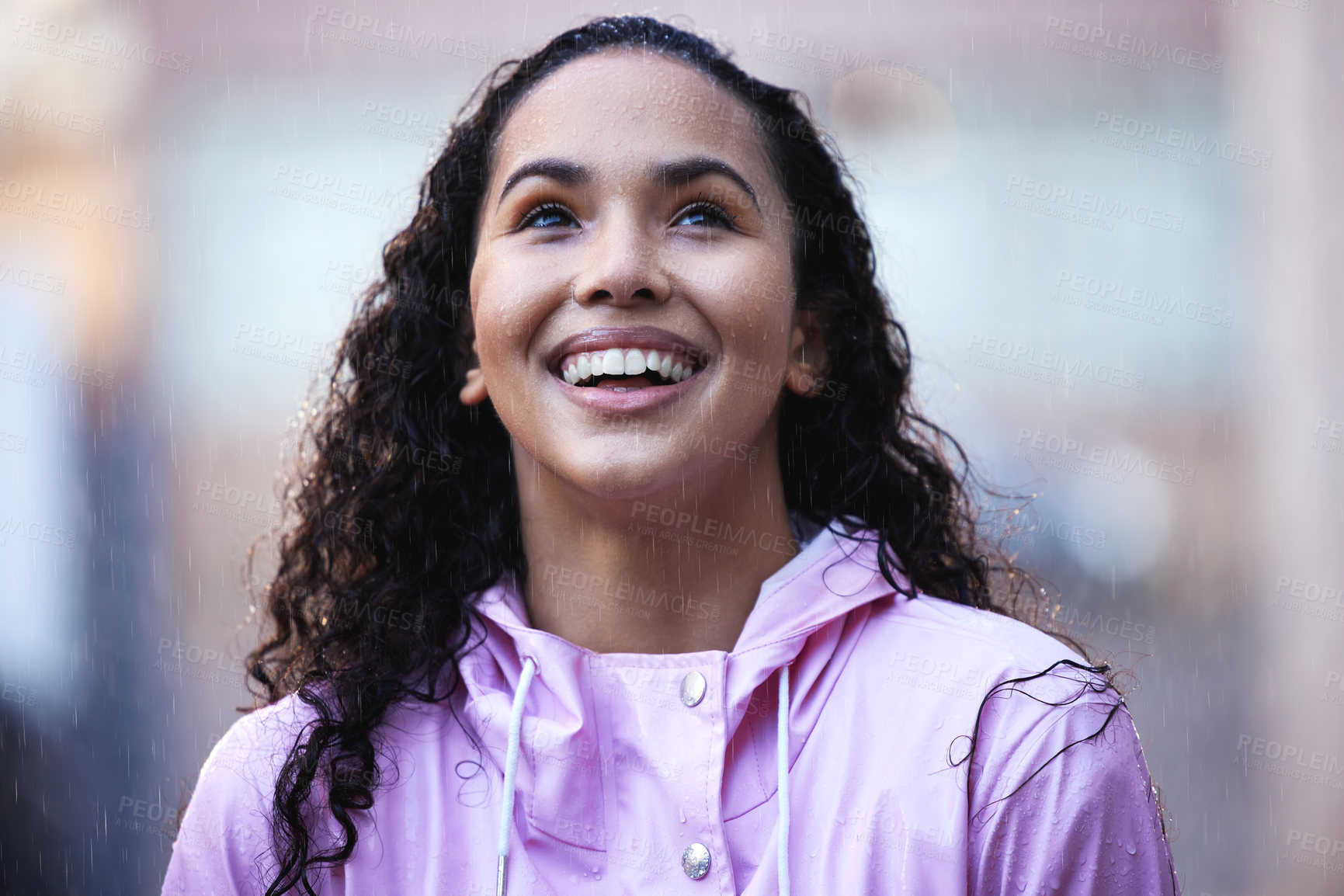 Buy stock photo Smile, woman and winter with rain in city and gratitude, freedom or wellness in storm. Female person, water splash and happy for travel or commute on sidewalk for mindfulness or calm in New York