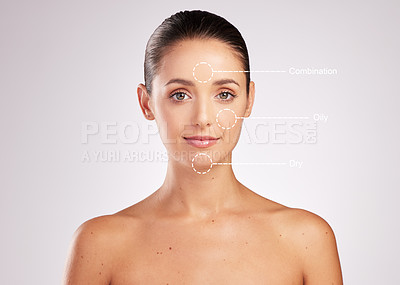 Buy stock photo Shot of an attractive young woman with skin types indicated on her face against a studio background