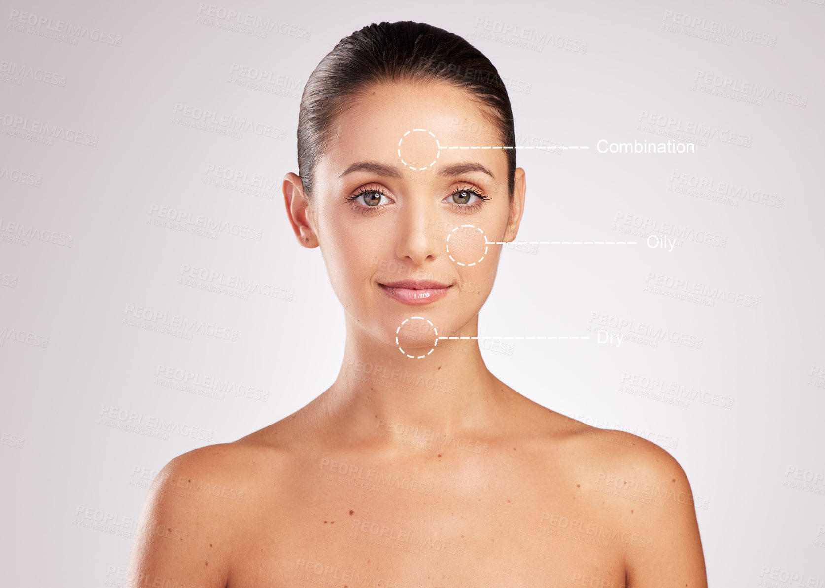 Buy stock photo Shot of an attractive young woman with skin types indicated on her face against a studio background