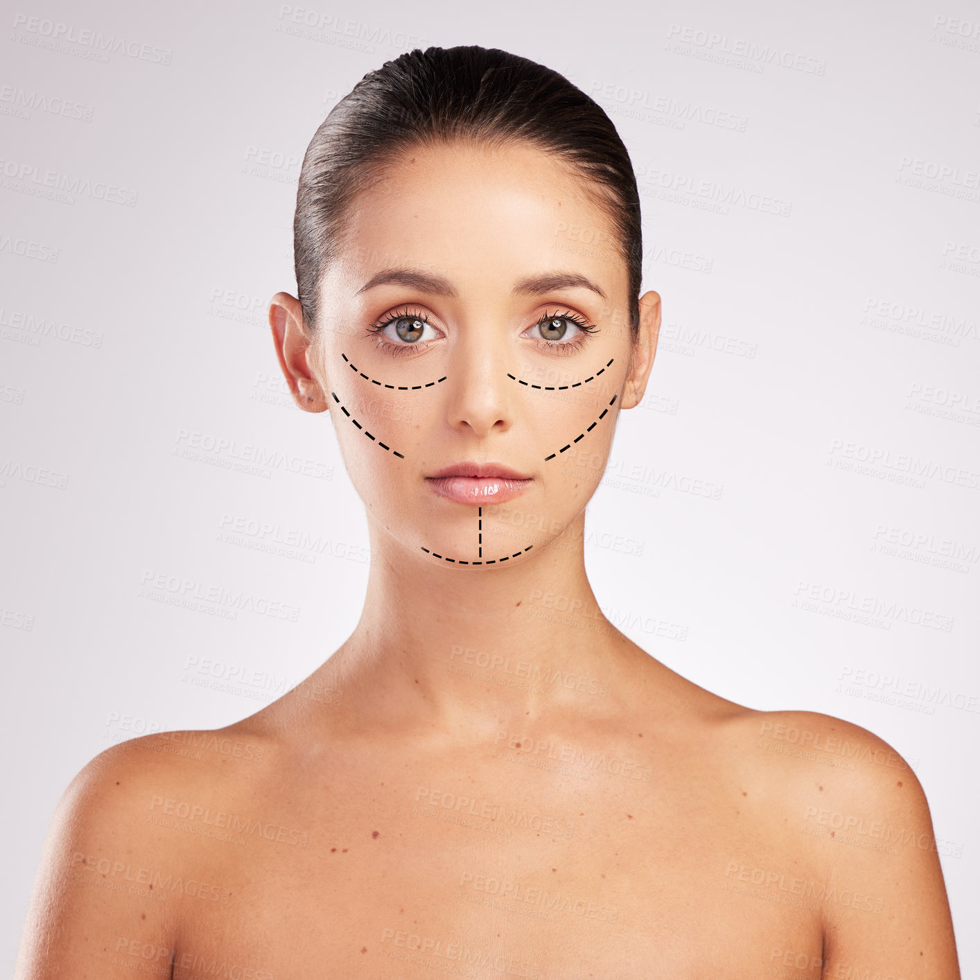 Buy stock photo Shot of an attractive young woman with cosmetic surgery markings on her face against a studio background