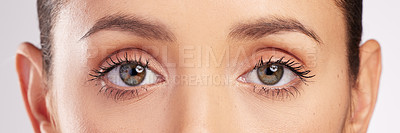 Buy stock photo Shot of an attractive young woman’s eyes against a studio background