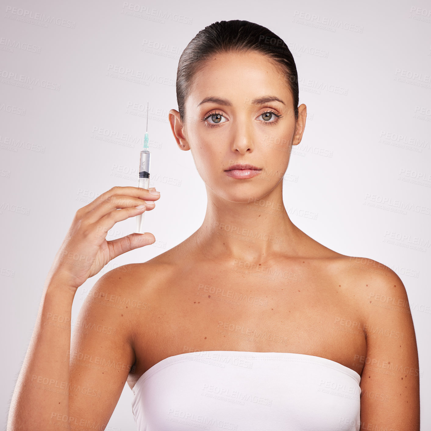 Buy stock photo Skincare, woman and portrait in studio with syringe for facelift, cosmetology or treatment on white background. Dermal filler, needle and hand of model for anti aging, plastic surgery or injection