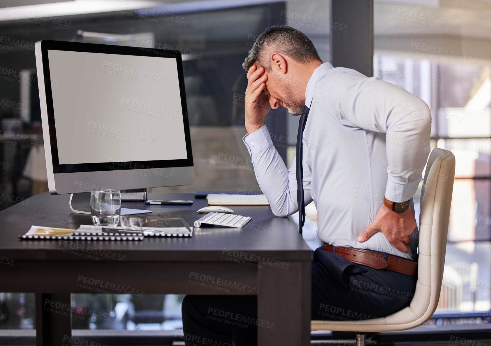 Buy stock photo Computer, desk and business man with back pain in office from anatomy emergency or bad posture. Corporate, burnout or medical and professional person with spine injury at table in company workplace