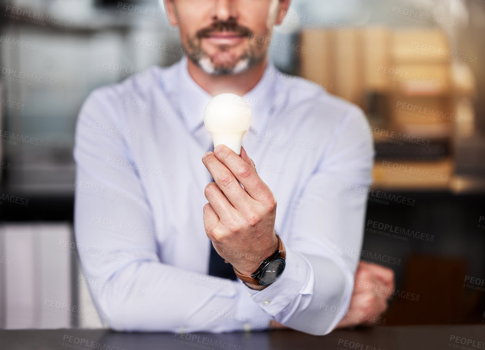 Buy stock photo Business, man and light bulb in hand and office, idea and vision for renewable energy or workplace innovation. Corporate, company for creativity breakthrough or solution, employee and problem solving