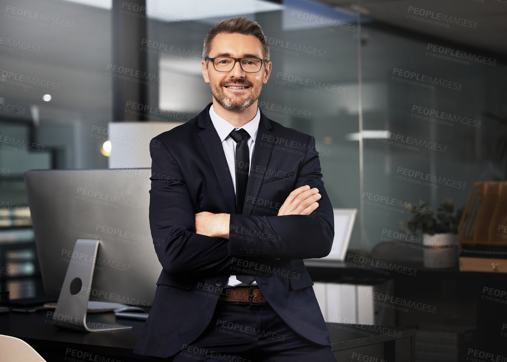 Buy stock photo Portrait of a businessman standing with his arms crossed in his office