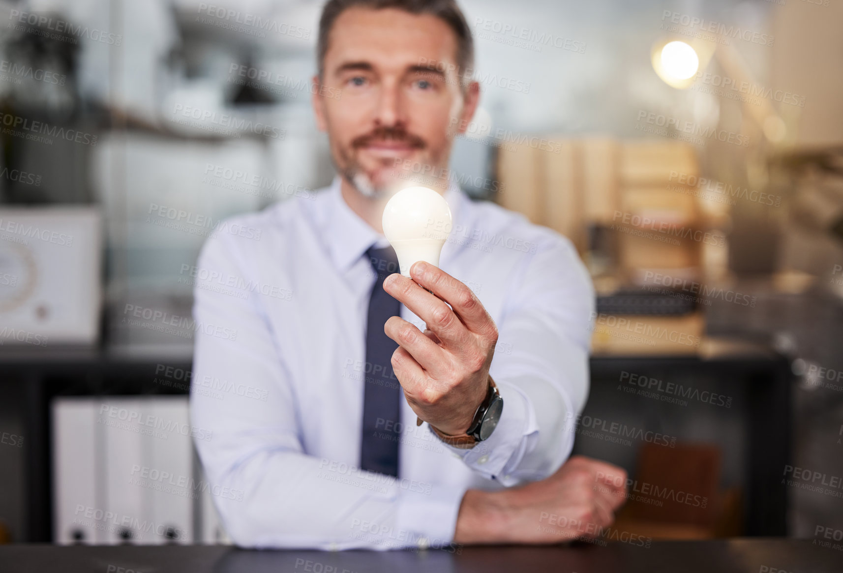 Buy stock photo Business, mature man and office with lightbulb for future, pride and hope for company and career growth. Portrait, project manager and smile or satisfied with innovation, knowledge and idea or vision
