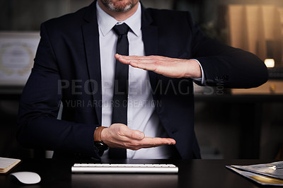 Buy stock photo Cropped shot of an unrecognisable businessman showing copyspace while sitting at his desk