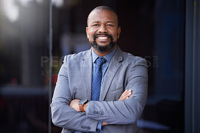 Buy stock photo Shot of a businessman wearing a suit while standing outside