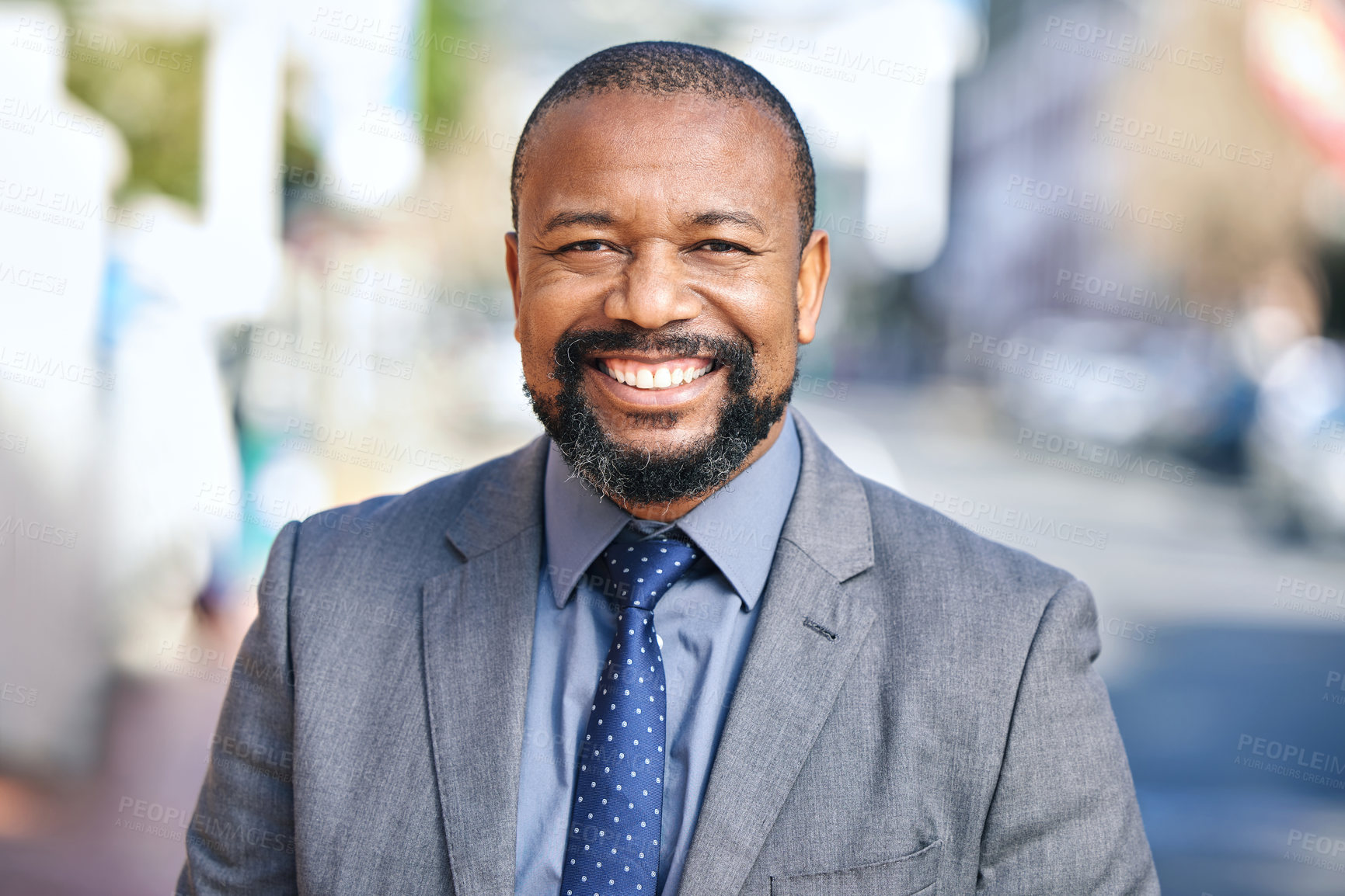 Buy stock photo Happy, black businessman and smile for leadership, empowerment and success outside in city. Male person, manager and leader with formal suit for confidence, pride and ambition with urban background