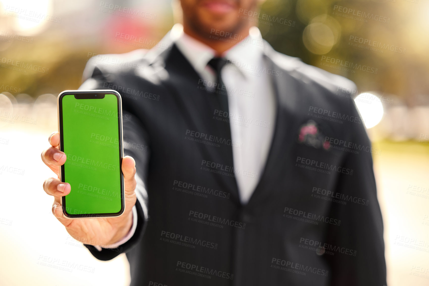 Buy stock photo Hand, show and outdoor with phone, green screen and person in corporate, business and advertising. Mobile, display and technology of product placement, suit and bokeh in city, park and New York