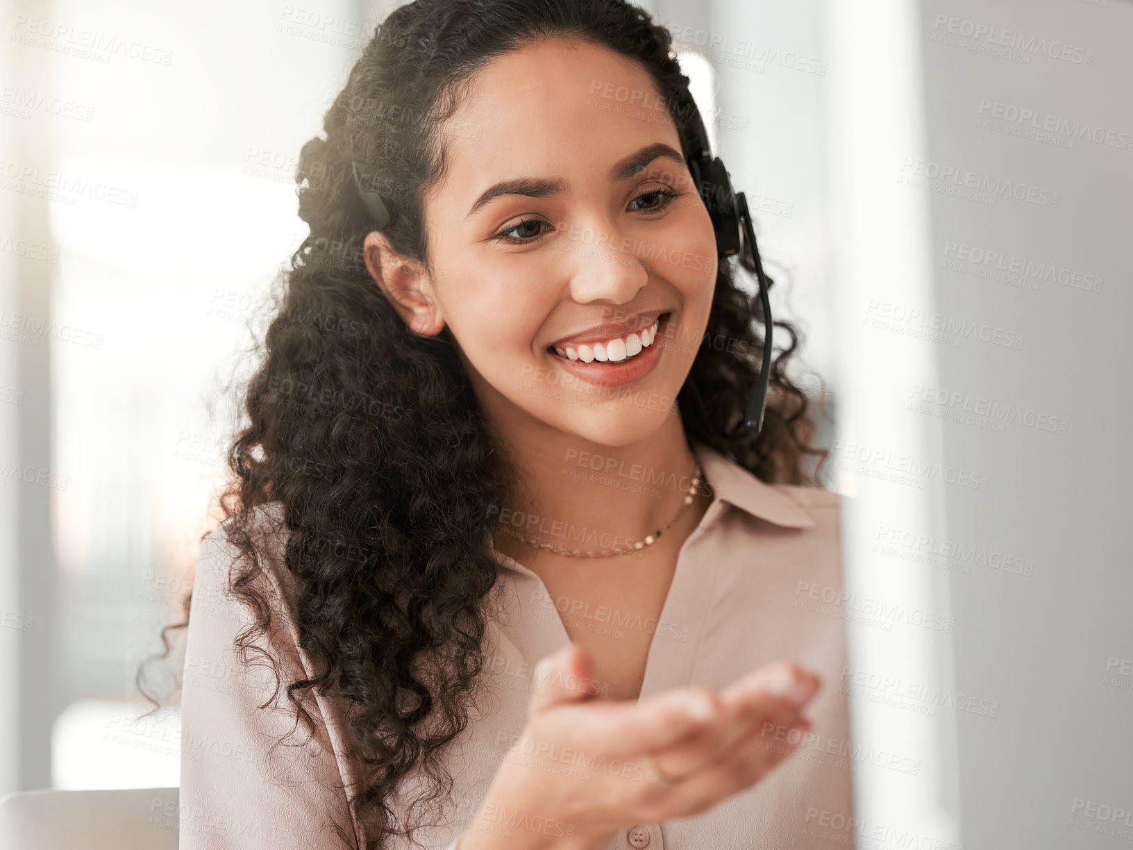 Buy stock photo Shot of a young female call center agent in an office at work