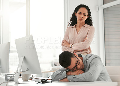 Buy stock photo Shot of a young male call center agent taking a nap at work