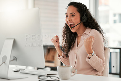 Buy stock photo Shot of a young female call center agent using a computer at work