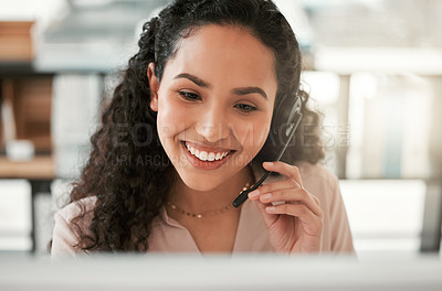 Buy stock photo Shot of a young female call center agent in an office at work