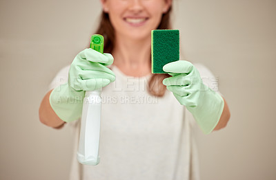 Buy stock photo Shot of an unrecognizable person holding cleaning supplies against a white background