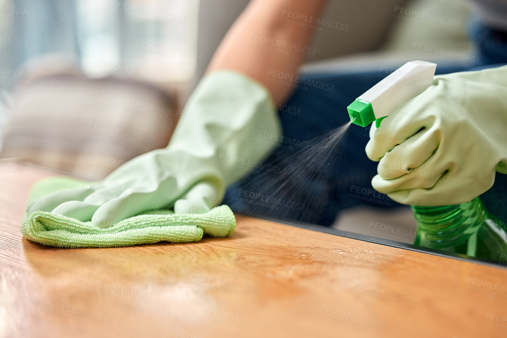 Buy stock photo Shot of an unrecognizable person cleaning a table at home