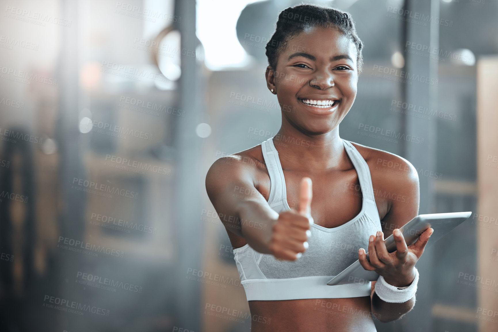 Buy stock photo Portrait of a young beautiful woman using a digital tablet and showing the thumbs up at the gym