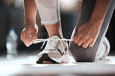 Buy stock photo Hands, shoelaces and floor at gym with woman, fitness and ready for workout, wellness or training. Girl, sport shoes or sneakers for exercise, performance or health for lifestyle, motivation and club