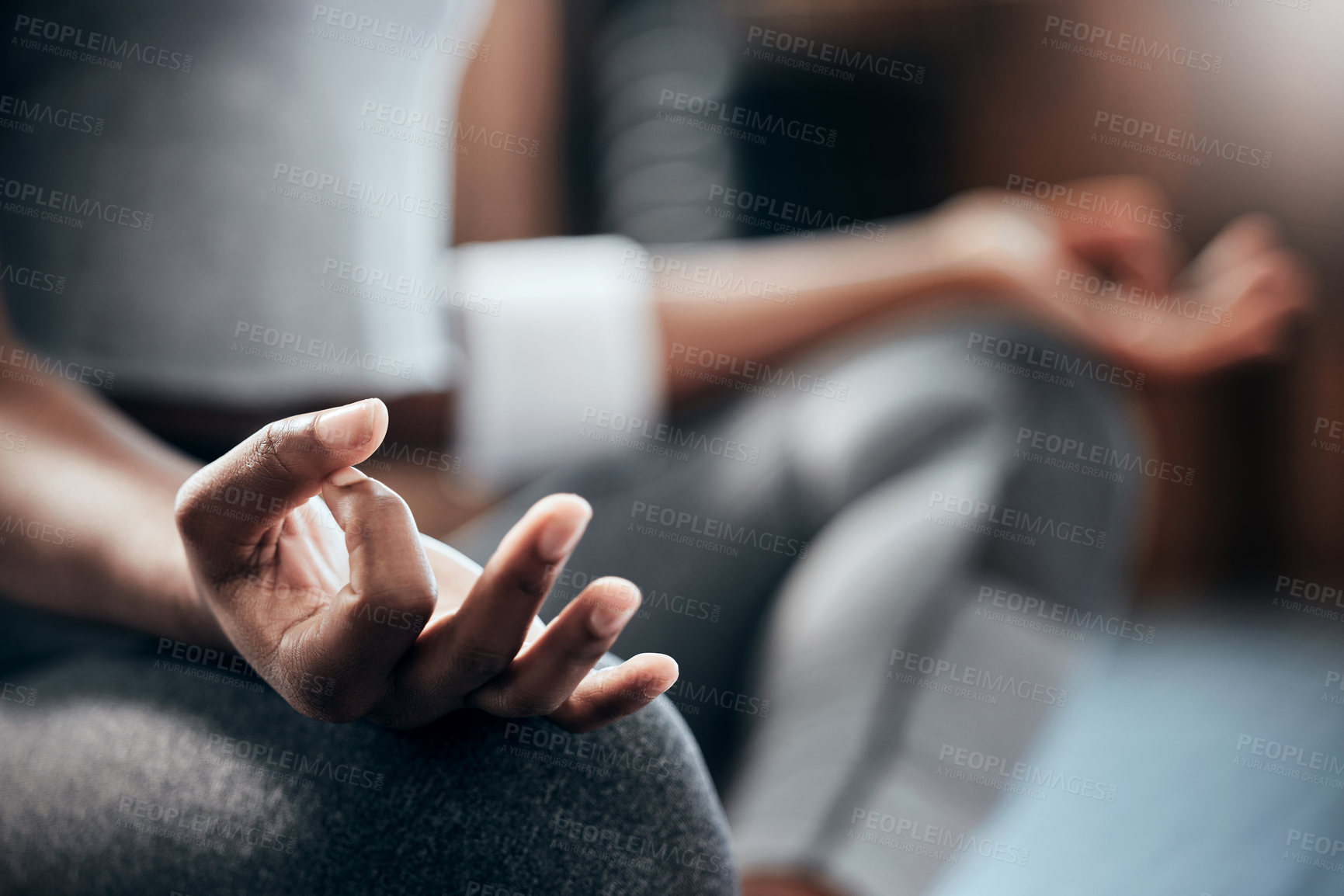 Buy stock photo Cropped shot of an unrecognizable young woman doing some deep meditation at the gym