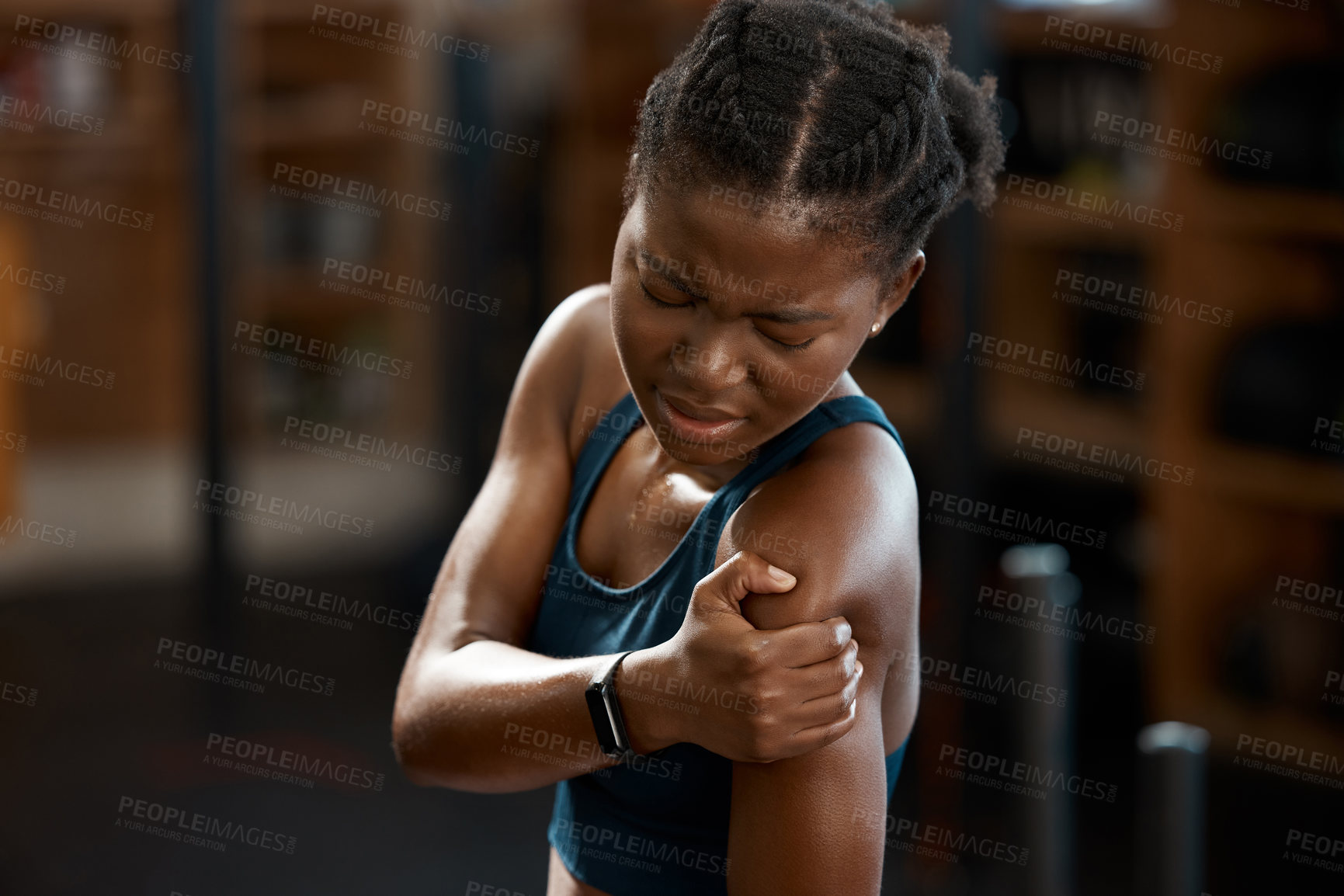 Buy stock photo African woman, sports and shoulder pain in gym from injury, exercise and accident while training. Female person, fitness and athlete with discomfort in arm from workout, cardio and muscle ache