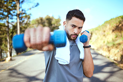 Buy stock photo Man, dumbbell and punches in nature fitness for exercise, workout or training in the outdoors. Portrait of fit, active and sporty male person punching with weights in healthy outdoor cardio endurance