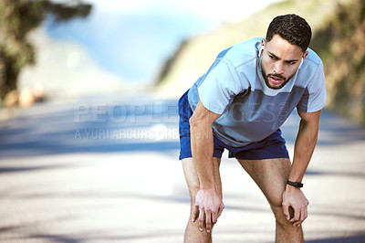 Buy stock photo Fitness, man and tired outdoor with music on a run or workout with earphones. Male athlete person or runner listening to audio on a road for cardio training, running or exercise break to breathe