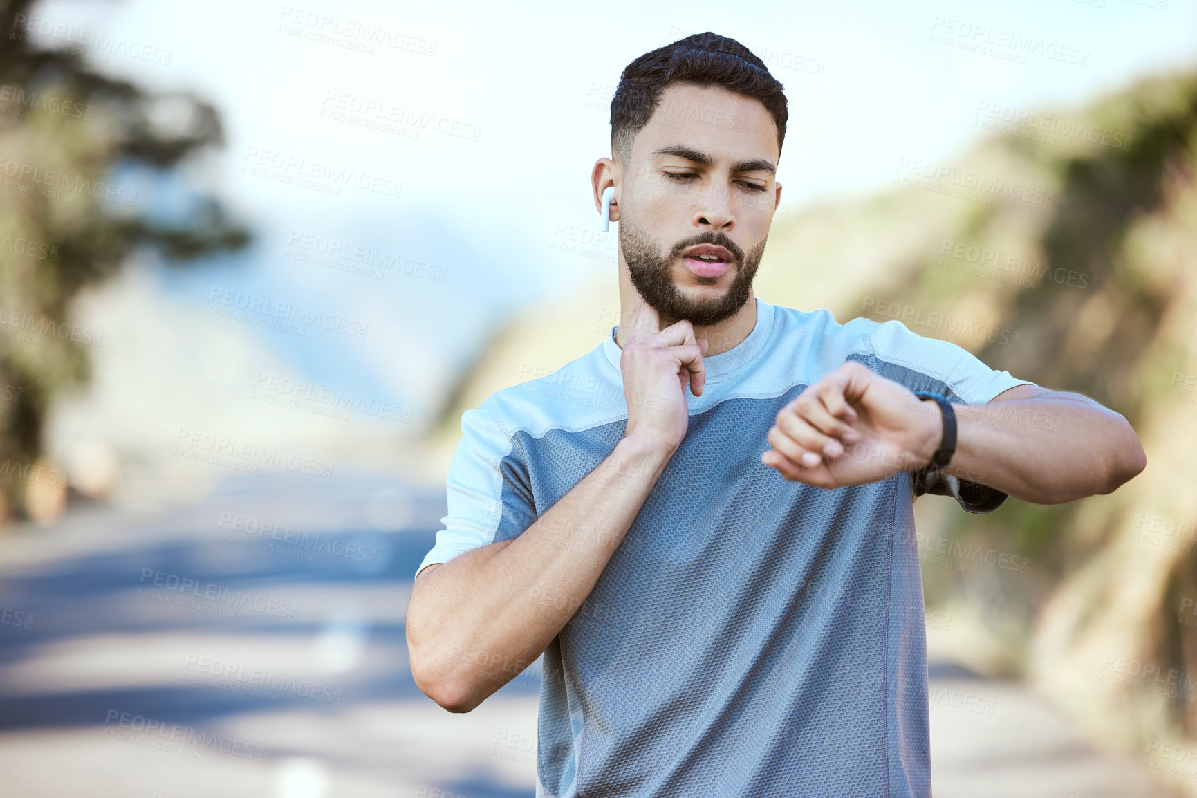 Buy stock photo Man, fitness and running with watch for pulse, heart rate or checking performance after cardio workout in nature. Male person, athlete or runner looking at wristwatch during outdoor run or exercise