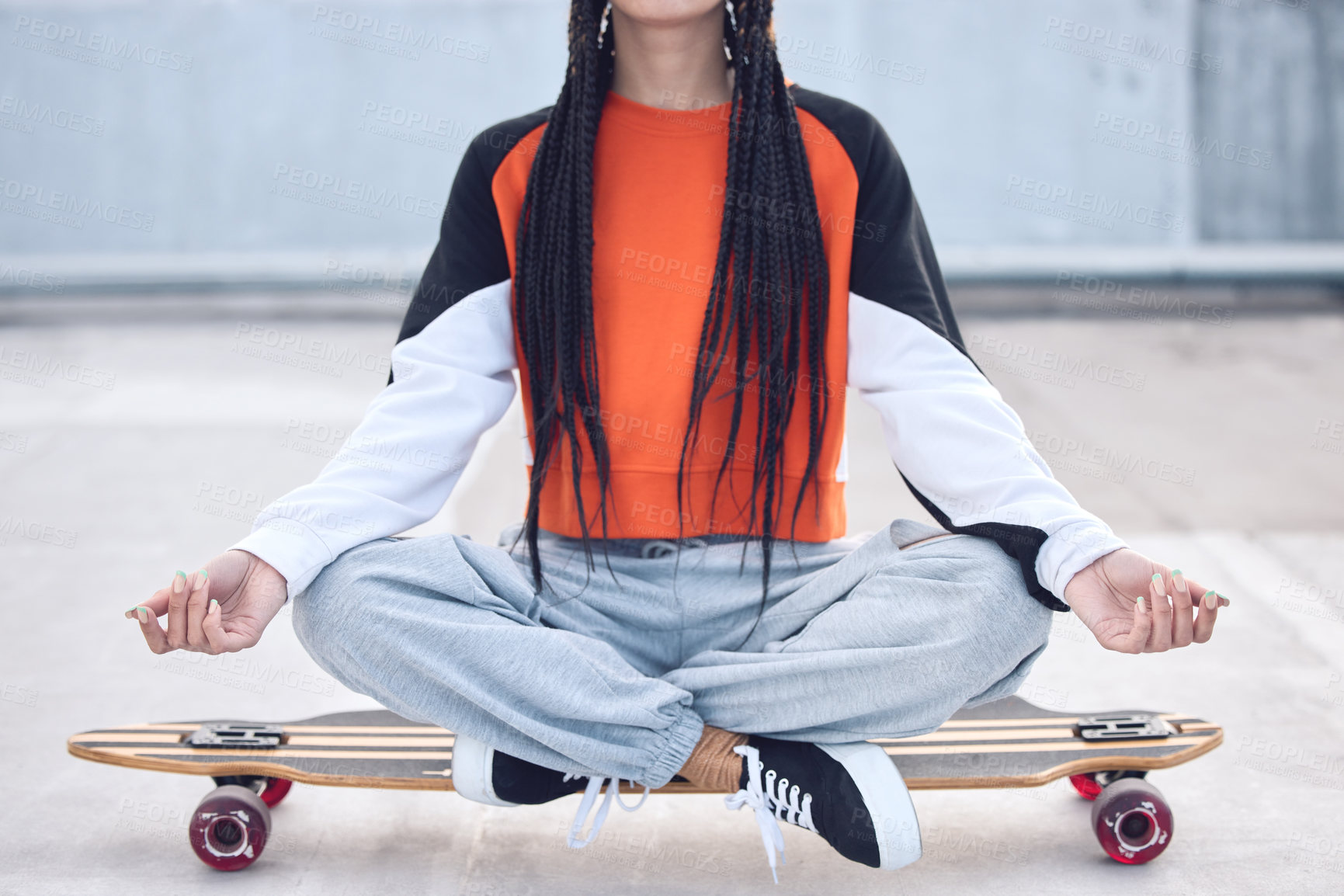 Buy stock photo Meditate, relax and woman on skateboard outdoor for freedom with streetwear, peace and concrete floor. Gen z girl, lotus pose and longboard for calm breathing, zen health and eco friendly transport