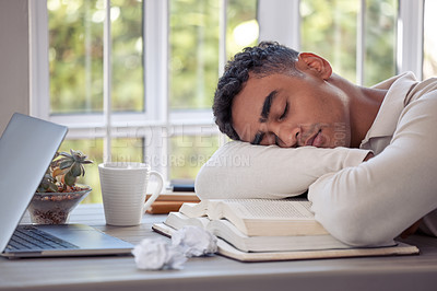 Buy stock photo Shot of a young male sleeping on the table at home
