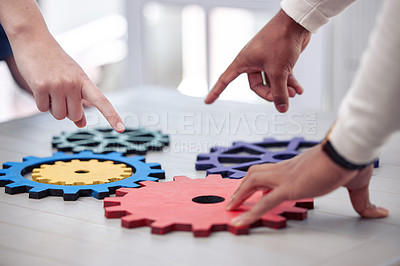 Buy stock photo Shot of two business man working with mechanisms in a office