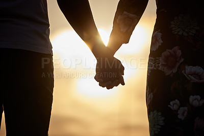 Buy stock photo Holding hands, love and trust by couple in support of marriage, commitment or unity at sunset. Man, woman and silhouette in solidarity of respect, empathy and care while united on Valentines Day