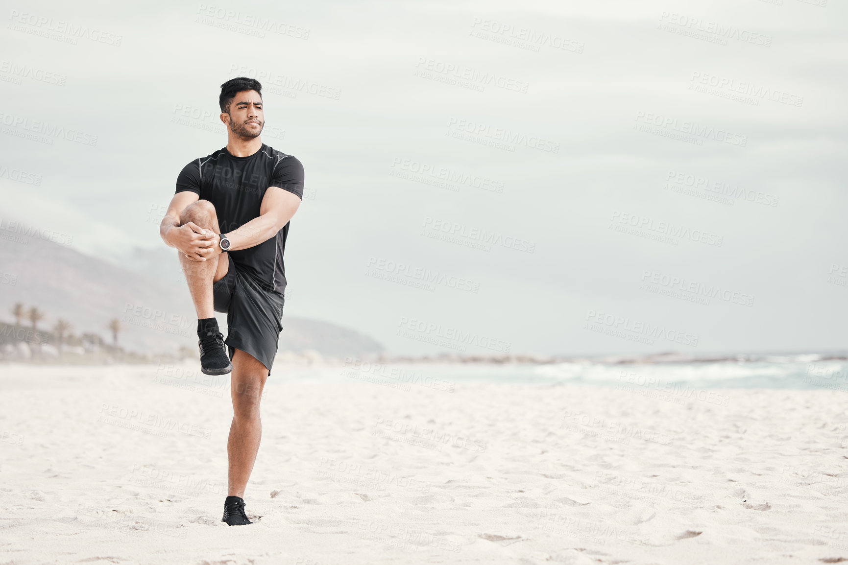 Buy stock photo Sea, balance or man stretching legs with fitness for body flexibility, thinking or wellness in running practice. Beach, sky or sports athlete ready for workout, mobility training or exercise warm up