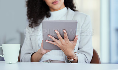 Buy stock photo Shot of a businesswoman using her digital tablet