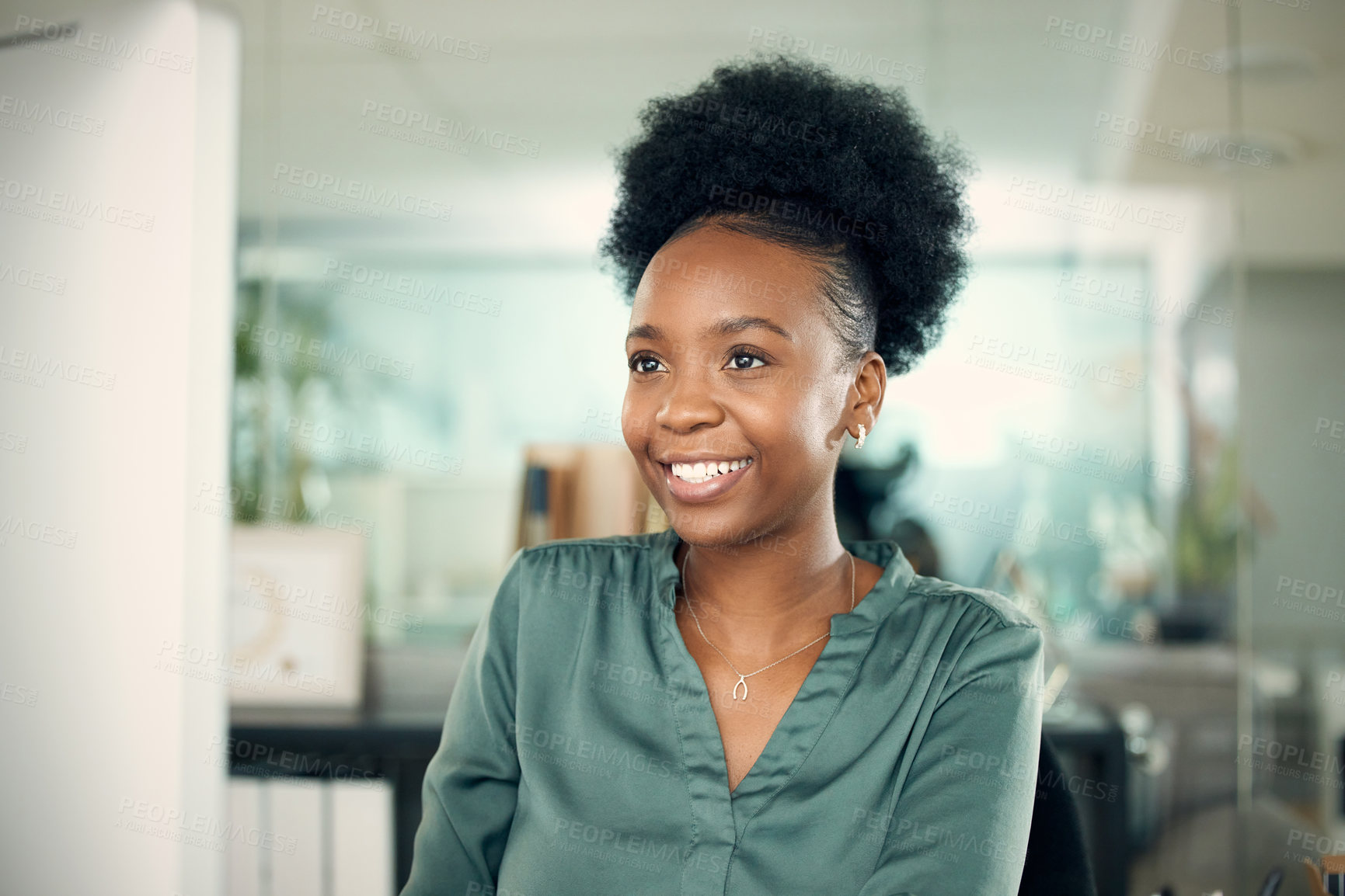 Buy stock photo Shot of a young businesswoman working on a computer in an office