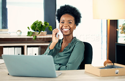 Buy stock photo Portrait of a young businesswoman talking on a cellphone in an office