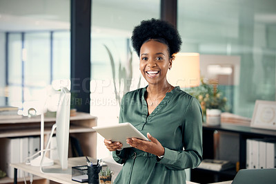 Buy stock photo Portrait of a young businesswoman using a digital tablet in an office