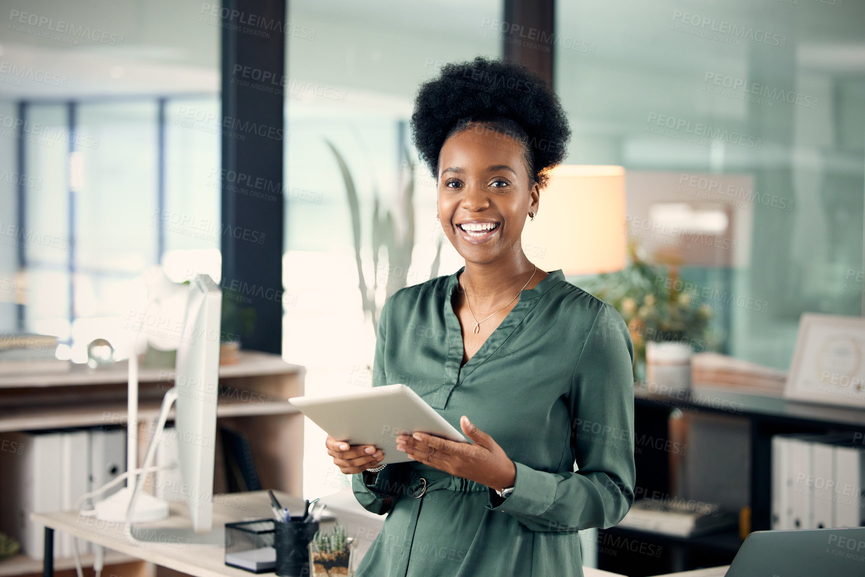 Buy stock photo Portrait of a young businesswoman using a digital tablet in an office