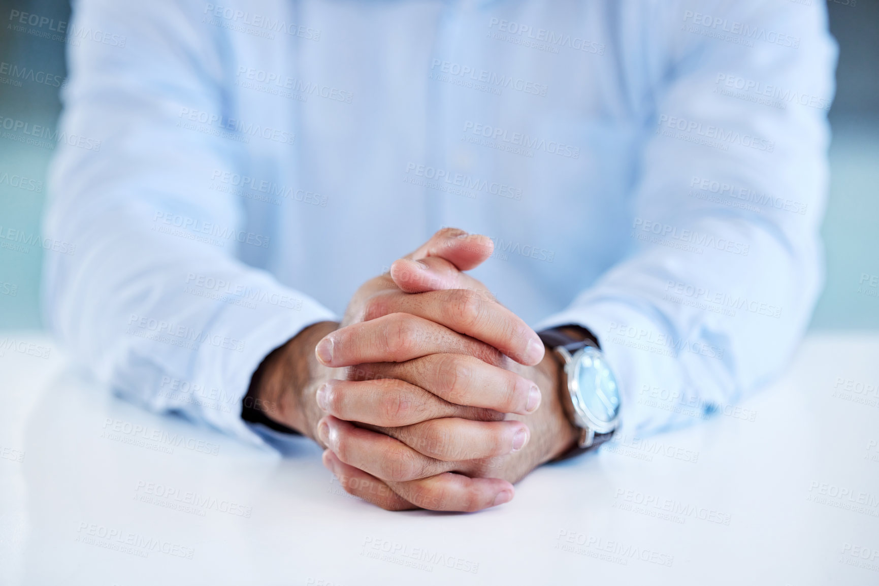 Buy stock photo Shot of a businessman sitting at his desk