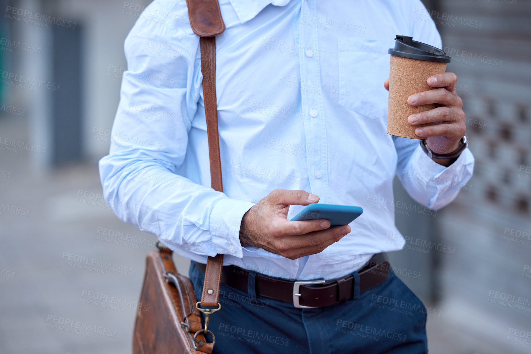 Buy stock photo Shot of a businessman using his smartphone to send a text message