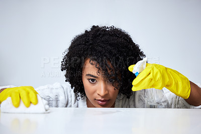 Buy stock photo Woman, spray and cleaning counter with detergent in kitchen for safety or protection from disease or dirt. Housekeeper, maintenance and disinfect table for health or wellness from virus or bacteria