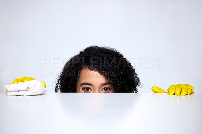 Buy stock photo Shot of a young woman cleaning her kitchen counter