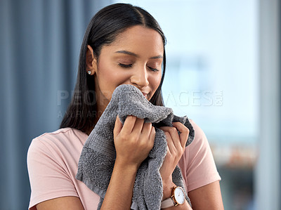 Buy stock photo Laundry, fresh linen and woman smelling towel after spring cleaning, housework and washing clothes in the morning. Chores, housekeeping and happy with female person with clean scent in home.