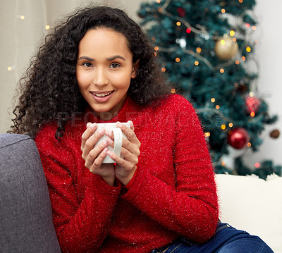 Buy stock photo Shot of a young woman drinking coffee on the couch at home