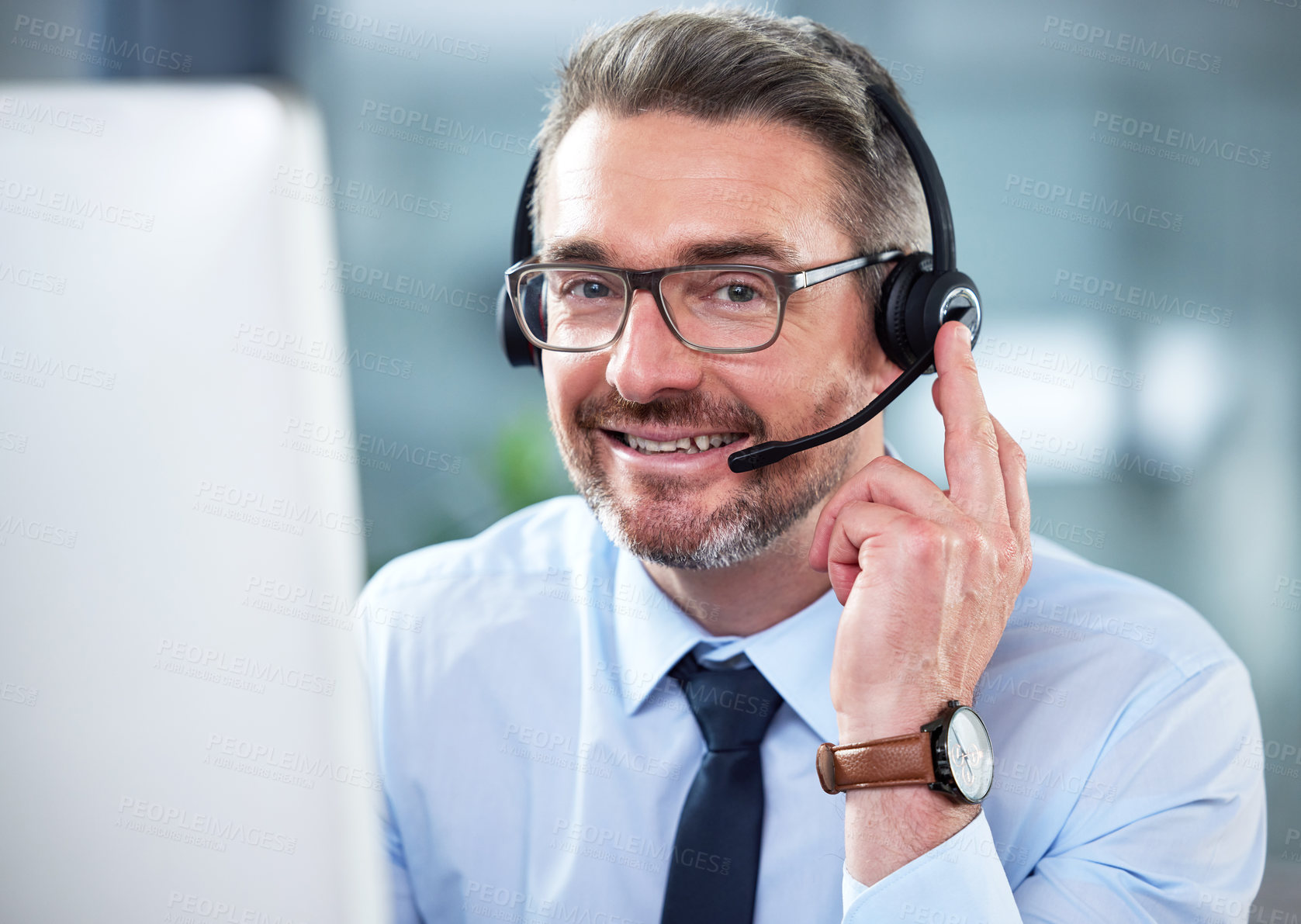 Buy stock photo Shot of a mature male call center agent working in an office