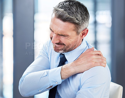 Buy stock photo Shot of a mature businessman suffering from backache at work