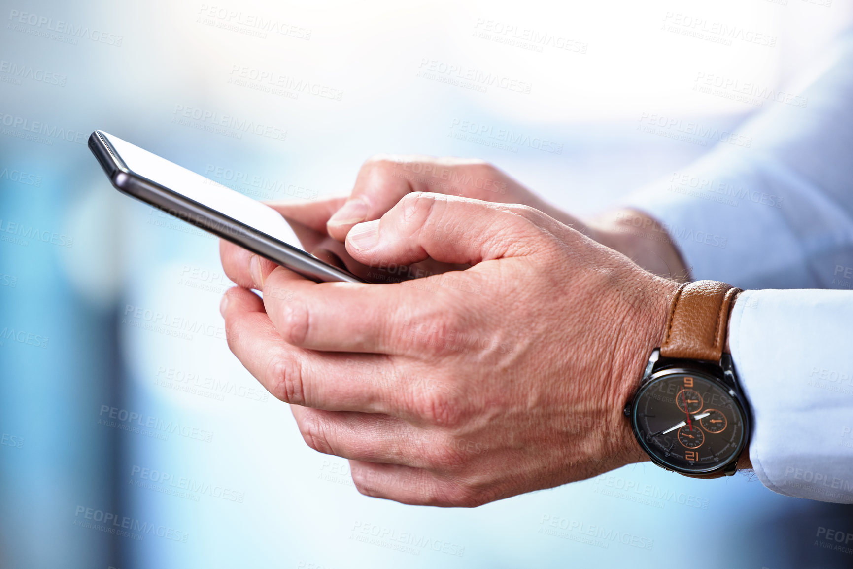 Buy stock photo Shot of an unrecognizable businessperson using a phone