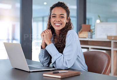 Buy stock photo Cropped portrait of an attractive young businesswoman working on her laptop while sitting in the office