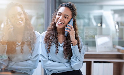 Buy stock photo Cropped shot of an attractive young businesswoman making a phonecall while standing in her office